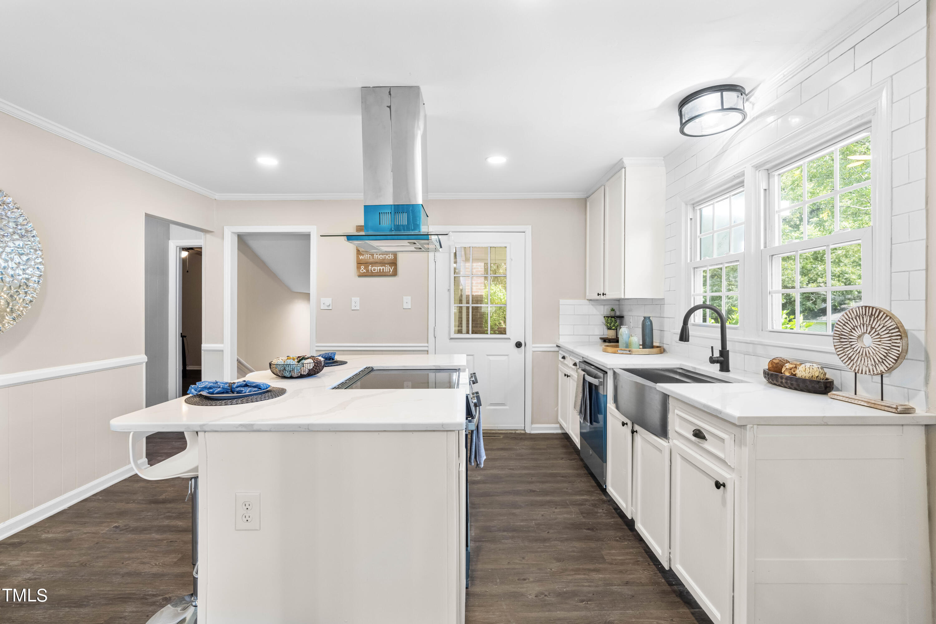 2616 Bullock Road Durham, NC 27704 - Photo 10 of 41 a kitchen with sink stove and white cabinets with wooden floor