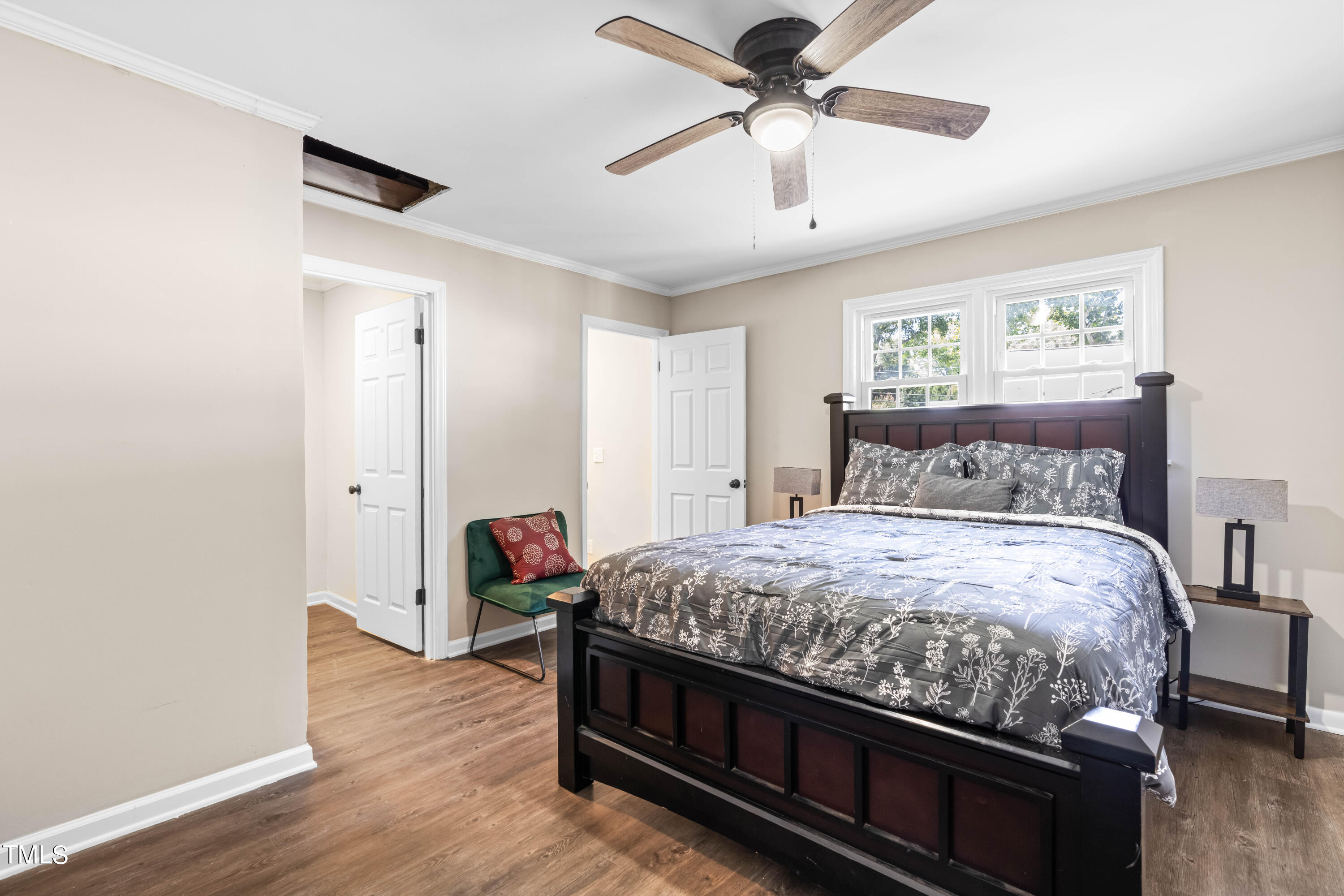 2616 Bullock Road Durham, NC 27704 - Photo 16 of 41 a bedroom with bed and wooden floor