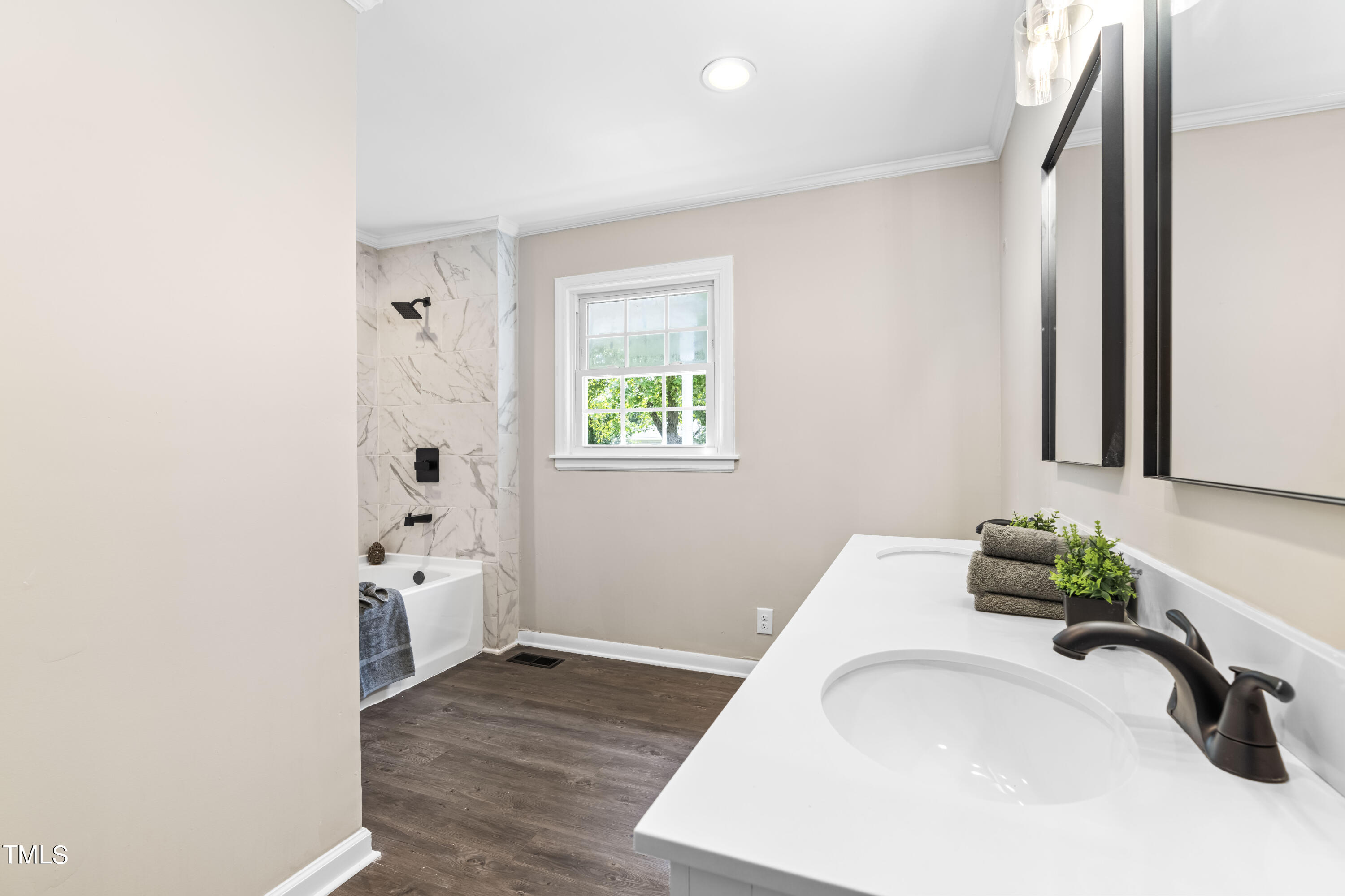 2616 Bullock Road Durham, NC 27704 - Photo 17 of 41 a bathroom with a granite countertop sink and a mirror