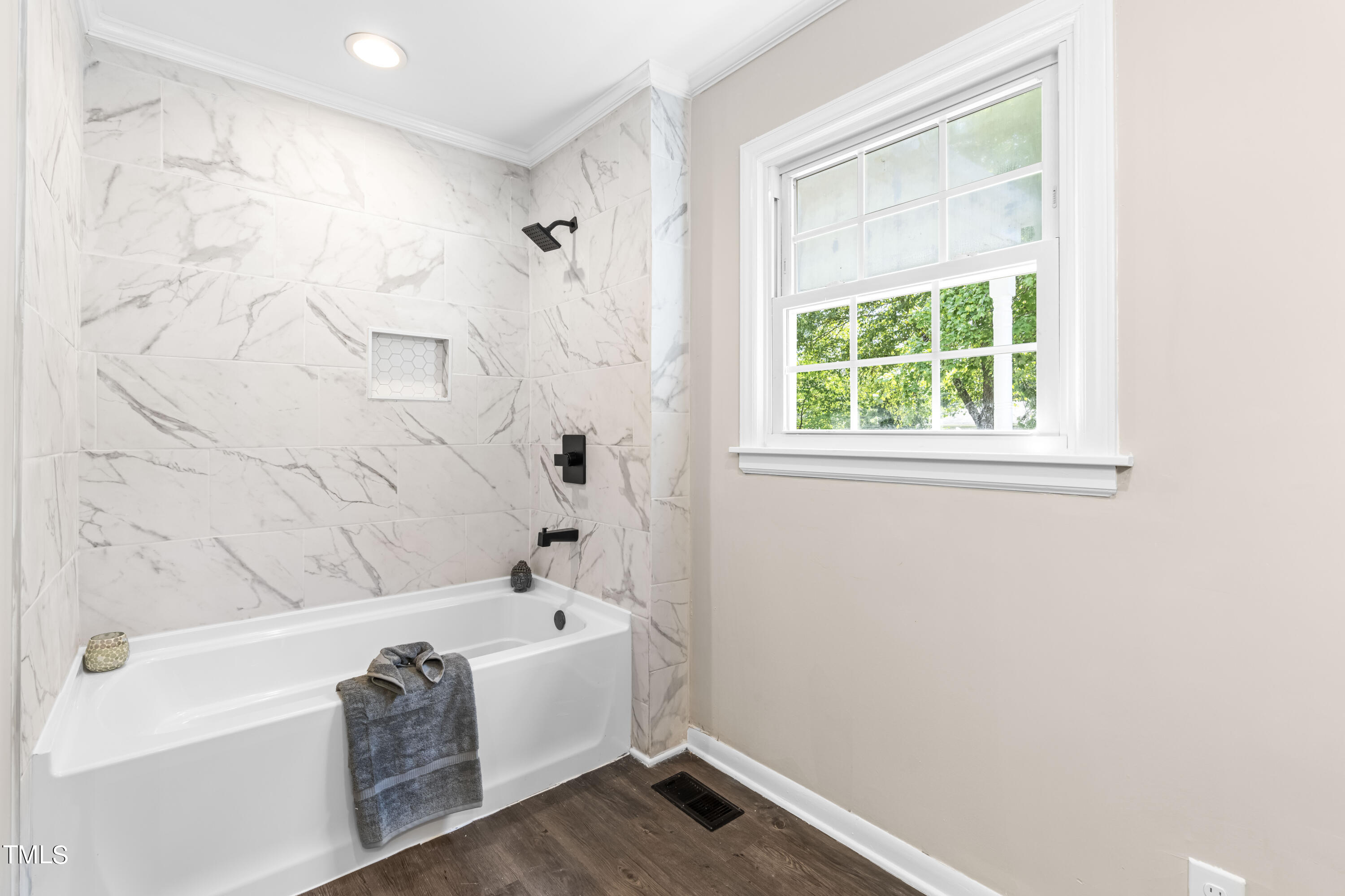 2616 Bullock Road Durham, NC 27704 - Photo 19 of 41 a bathroom with a bathtub and a shower