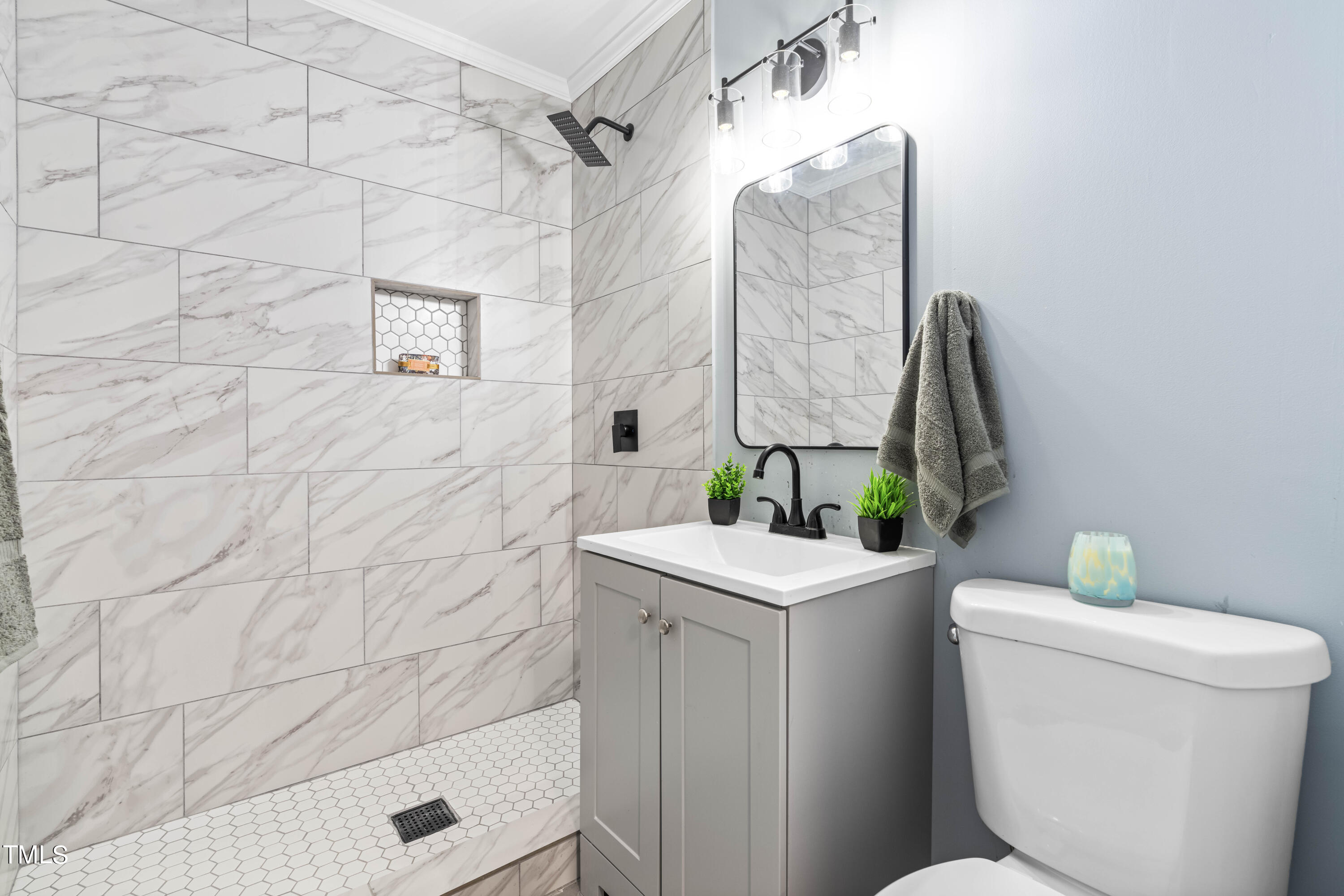 2616 Bullock Road Durham, NC 27704 - Photo 21 of 41 a bathroom with a sink a toilet and shower