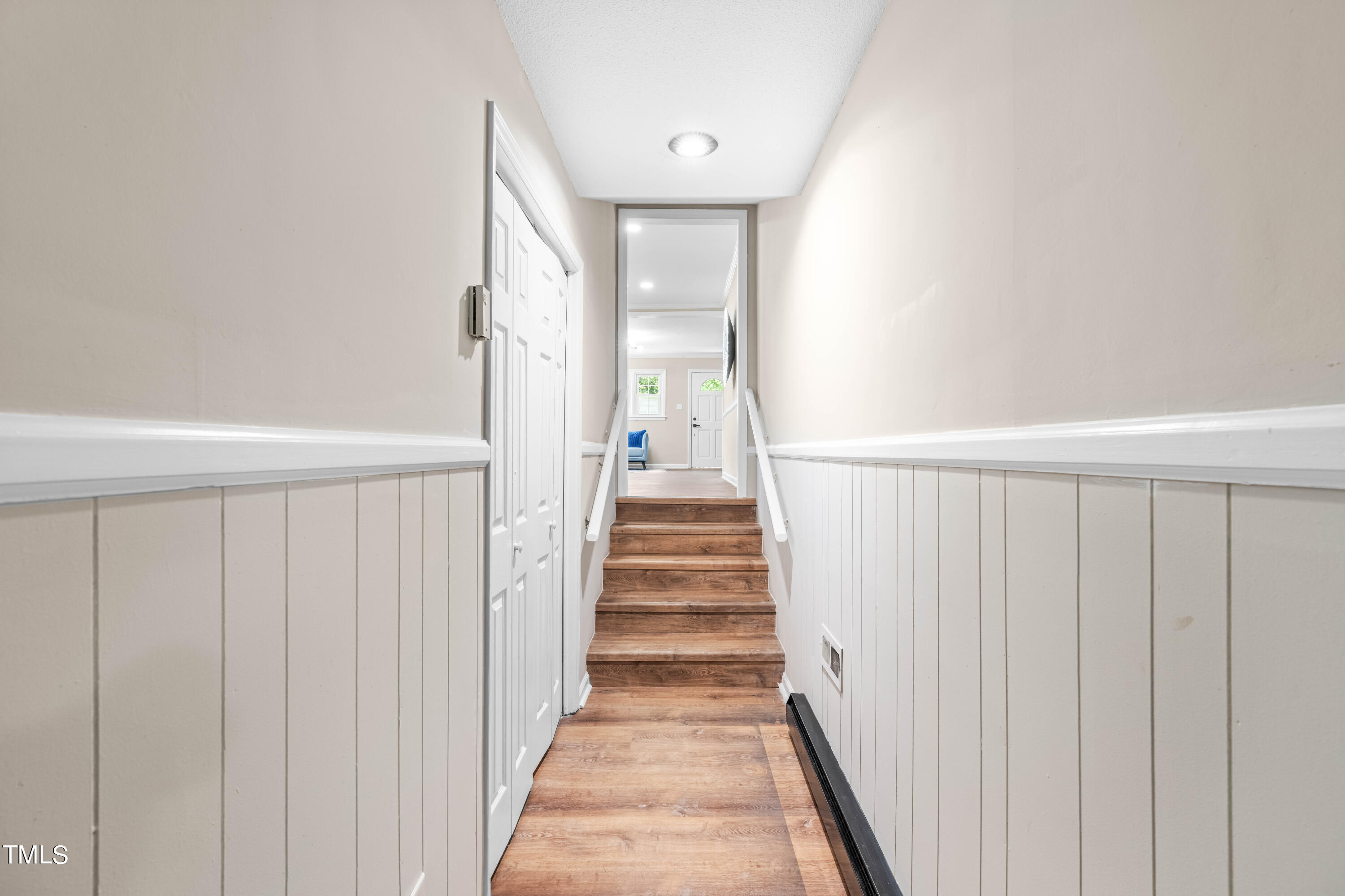 2616 Bullock Road Durham, NC 27704 - Photo 22 of 41 a view of a hallway with wooden floor and staircase