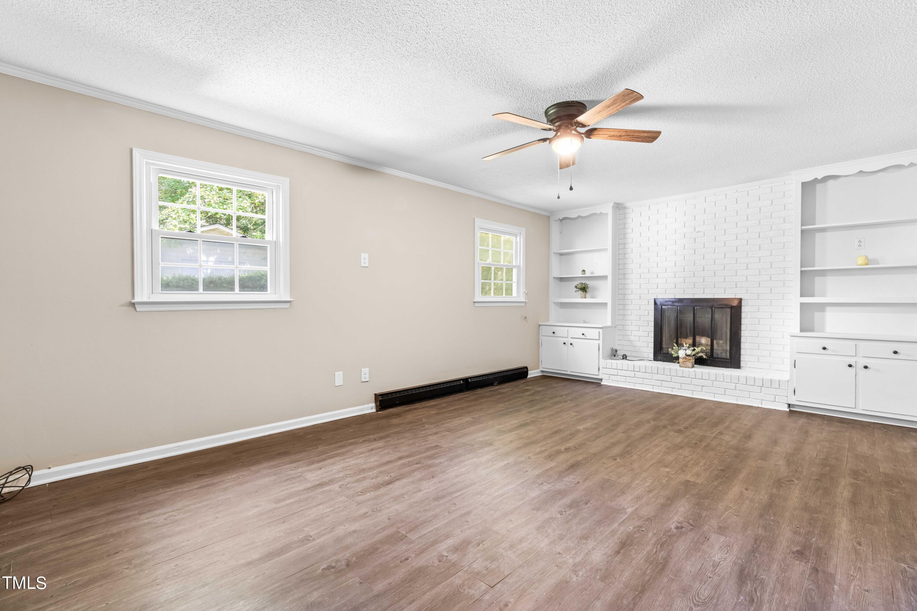 2616 Bullock Road Durham, NC 27704 - Photo 24 of 41 a view of an empty room with a window and a ceiling fan