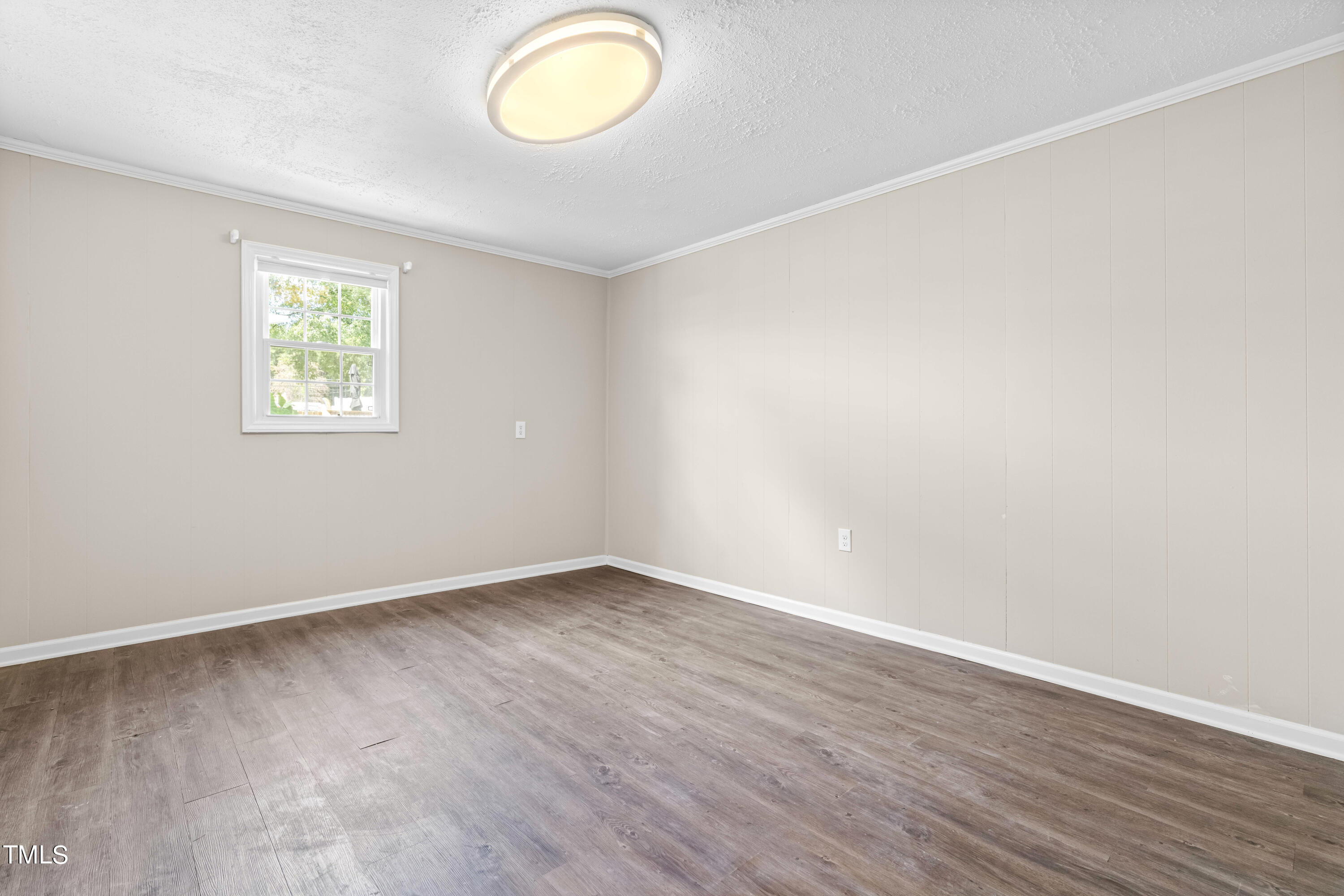 2616 Bullock Road Durham, NC 27704 - Photo 26 of 41 an empty room with wooden floor and window