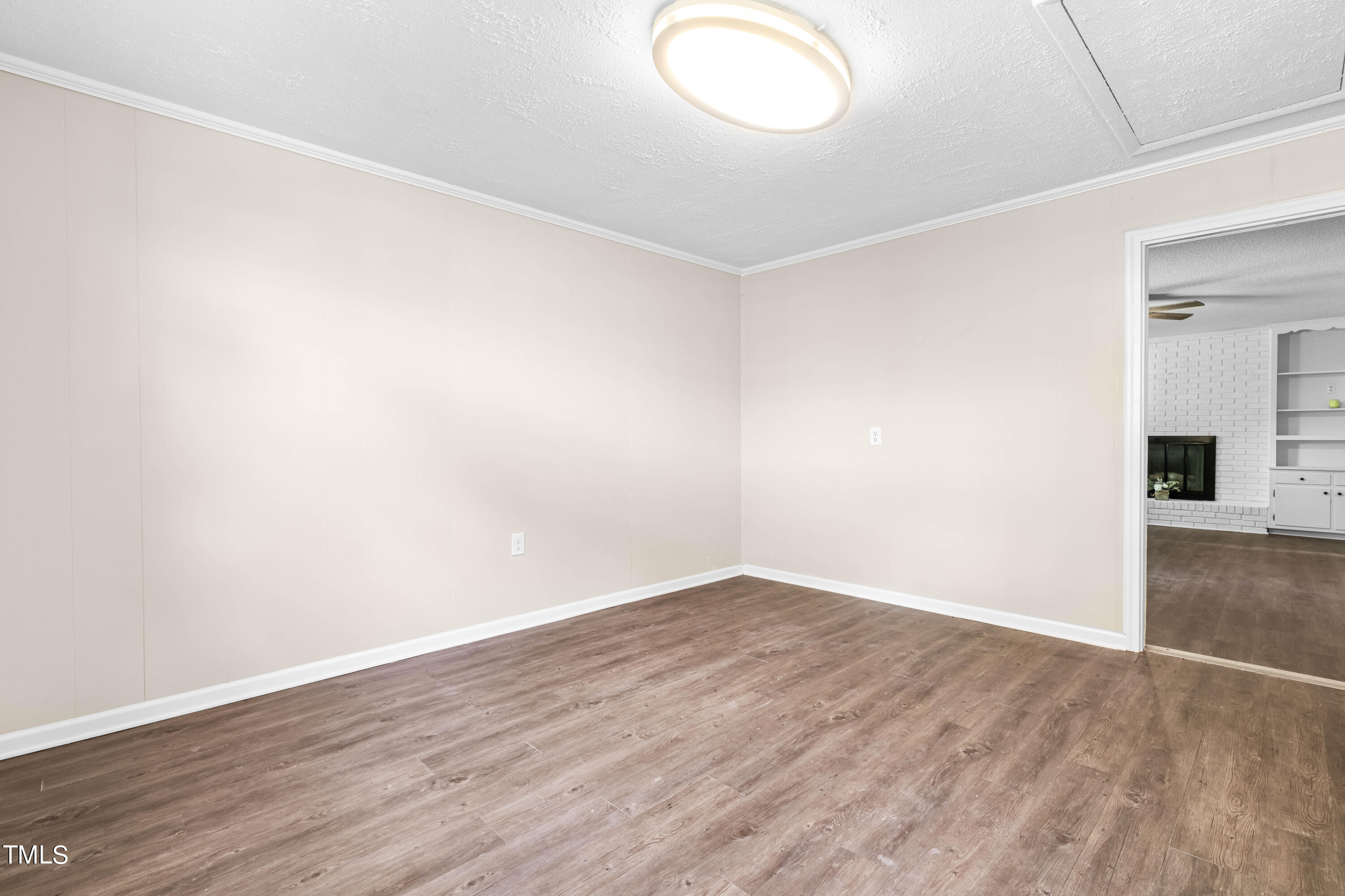 2616 Bullock Road Durham, NC 27704 - Photo 28 of 41 an empty room with wooden floor and windows