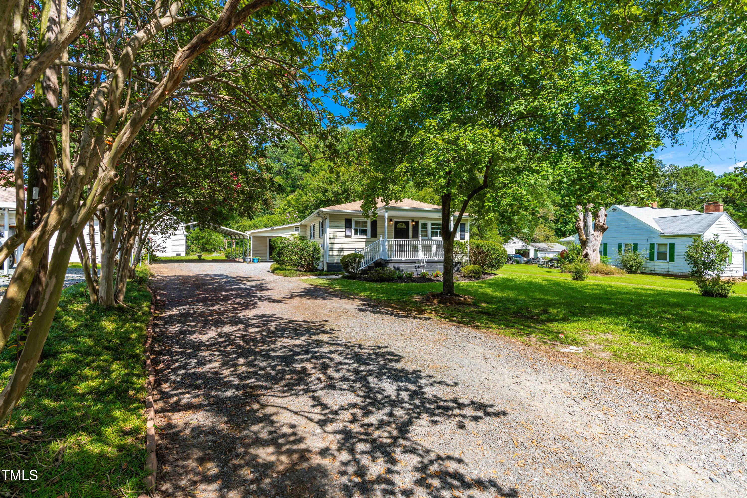 2616 Bullock Road Durham, NC 27704 - Photo 3 of 41 a front view of a house with a yard