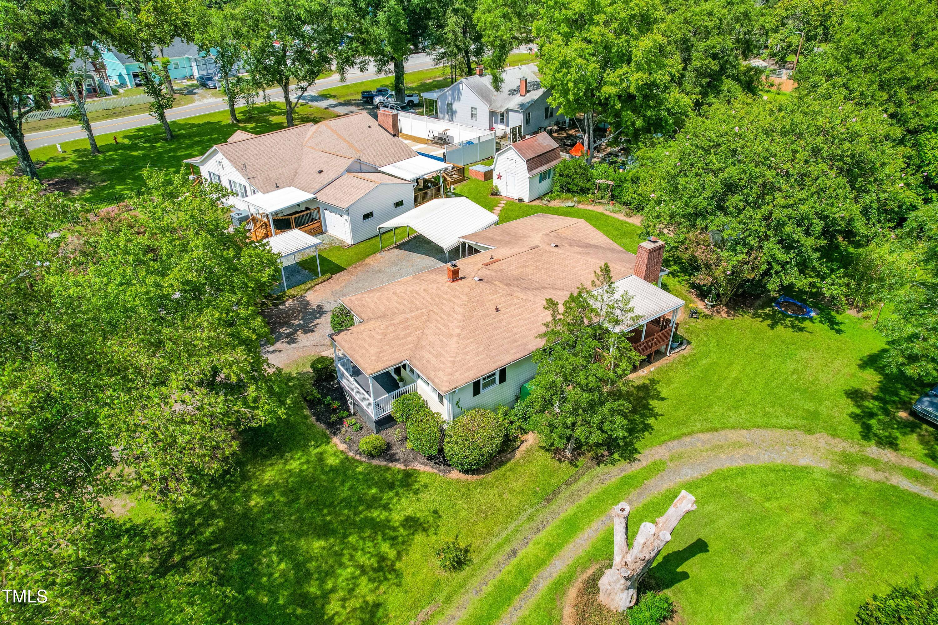 2616 Bullock Road Durham, NC 27704 - Photo 40 of 41 an aerial view of a house with a garden and swimming pool