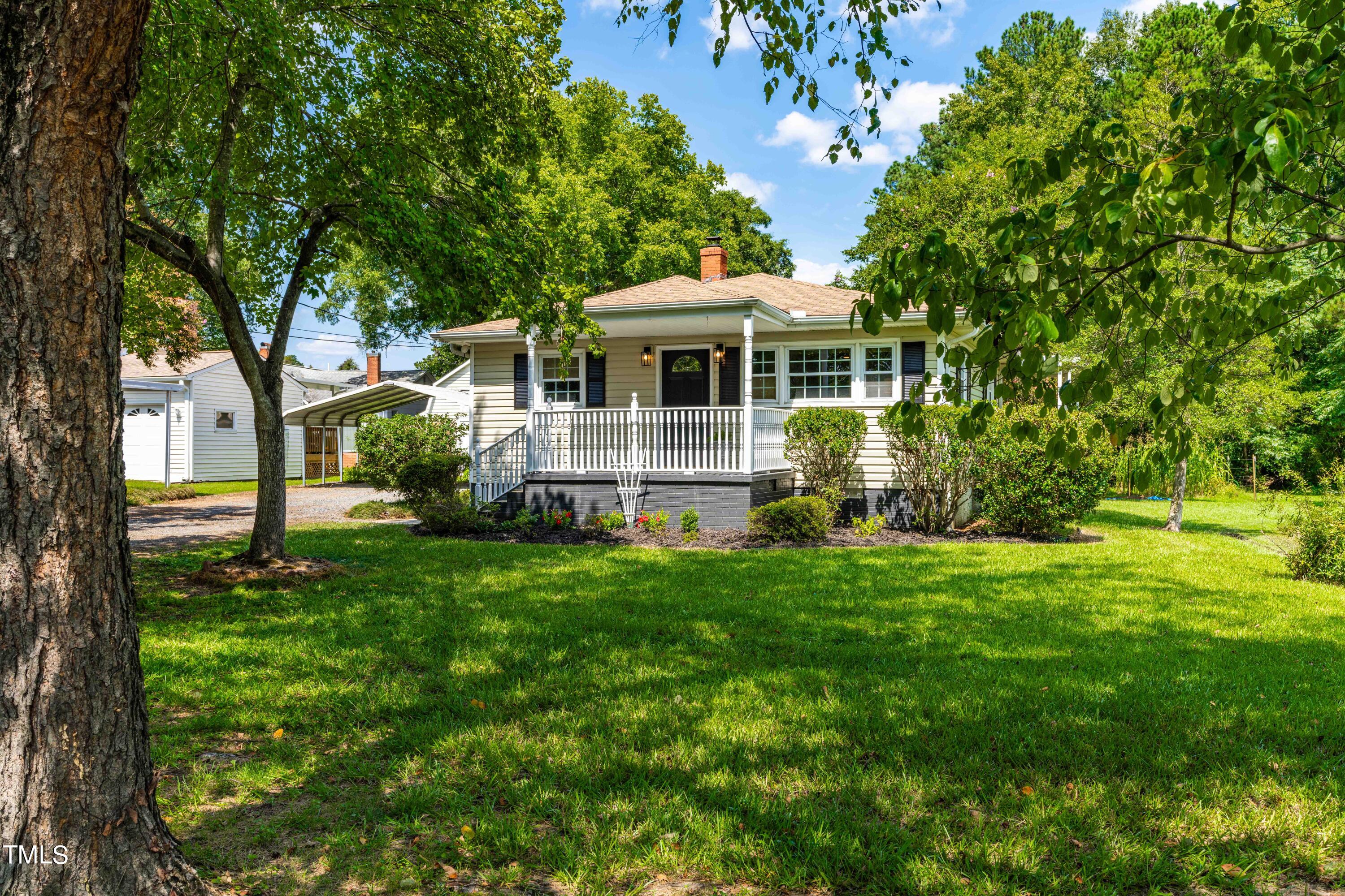 2616 Bullock Road Durham, NC 27704 - Photo 5 of 41 a front view of a house with a yard