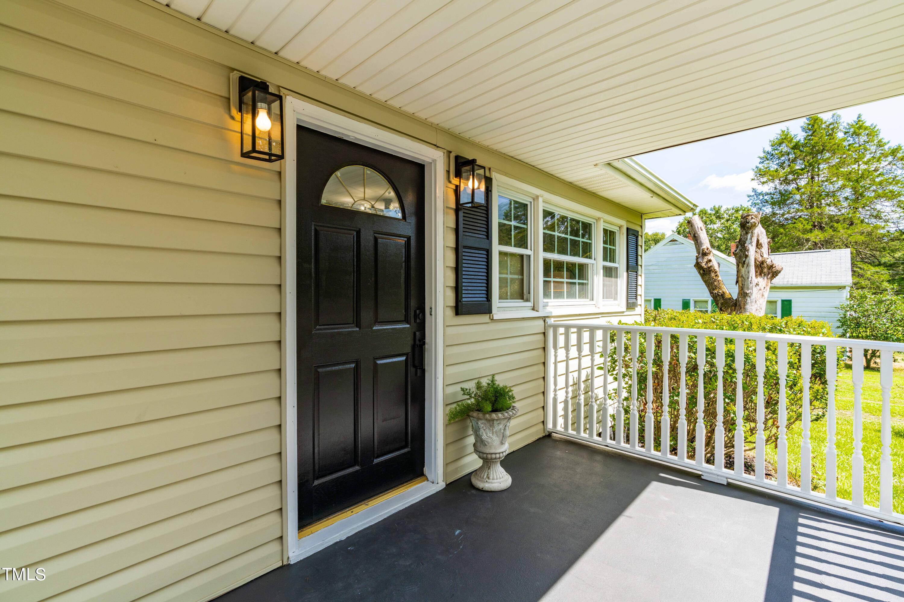 2616 Bullock Road Durham, NC 27704 - Photo 6 of 41 a front view of a house with a glass door