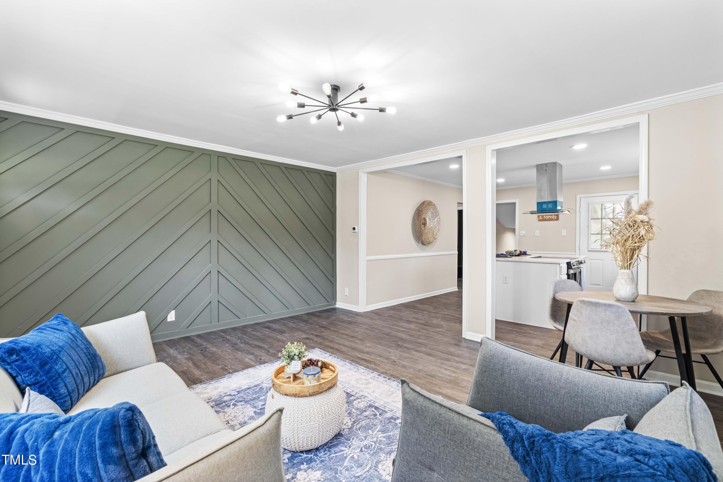 2616 Bullock Road Durham, NC 27704 - Photo 9 of 41 a living room with furniture and wooden floor