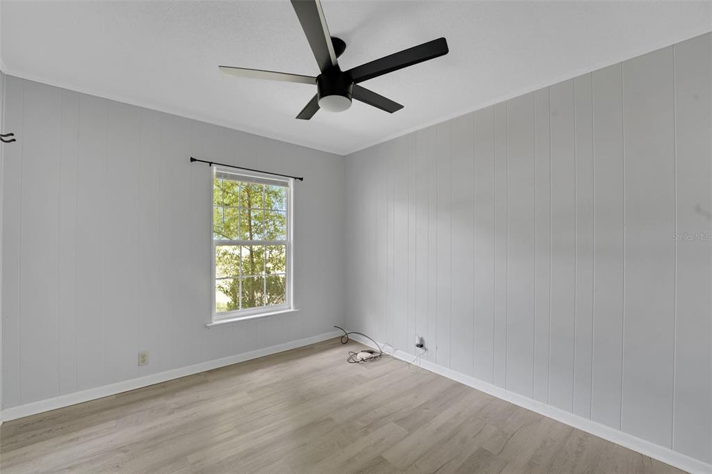 404 Lake Ned Road Winter Haven, FL 33884 - Photo 9 of 18 a view of an empty room with a window