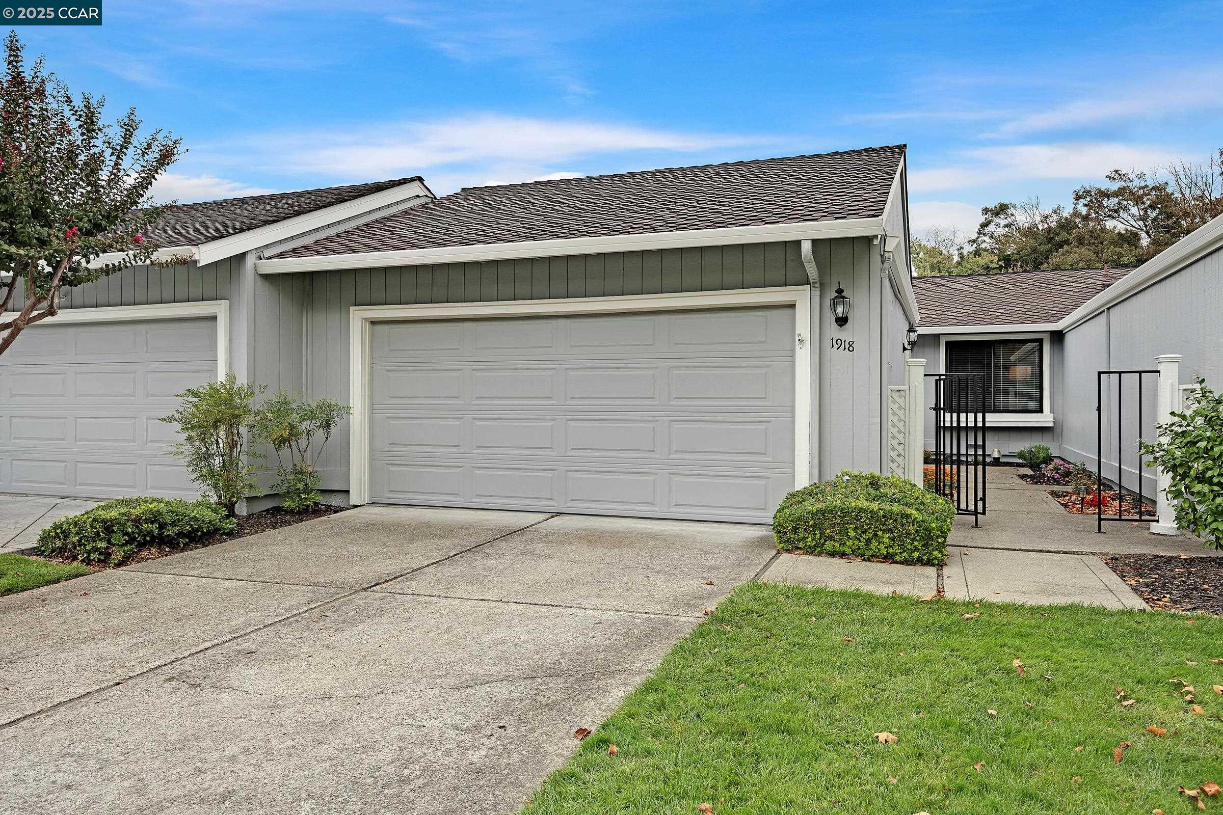 1918 St George Road Danville, CA 94526 - Photo 1 of 1 a front view of a house with a yard and potted plants