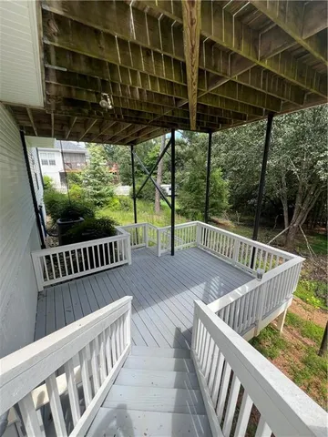 a view of balcony with wooden floor