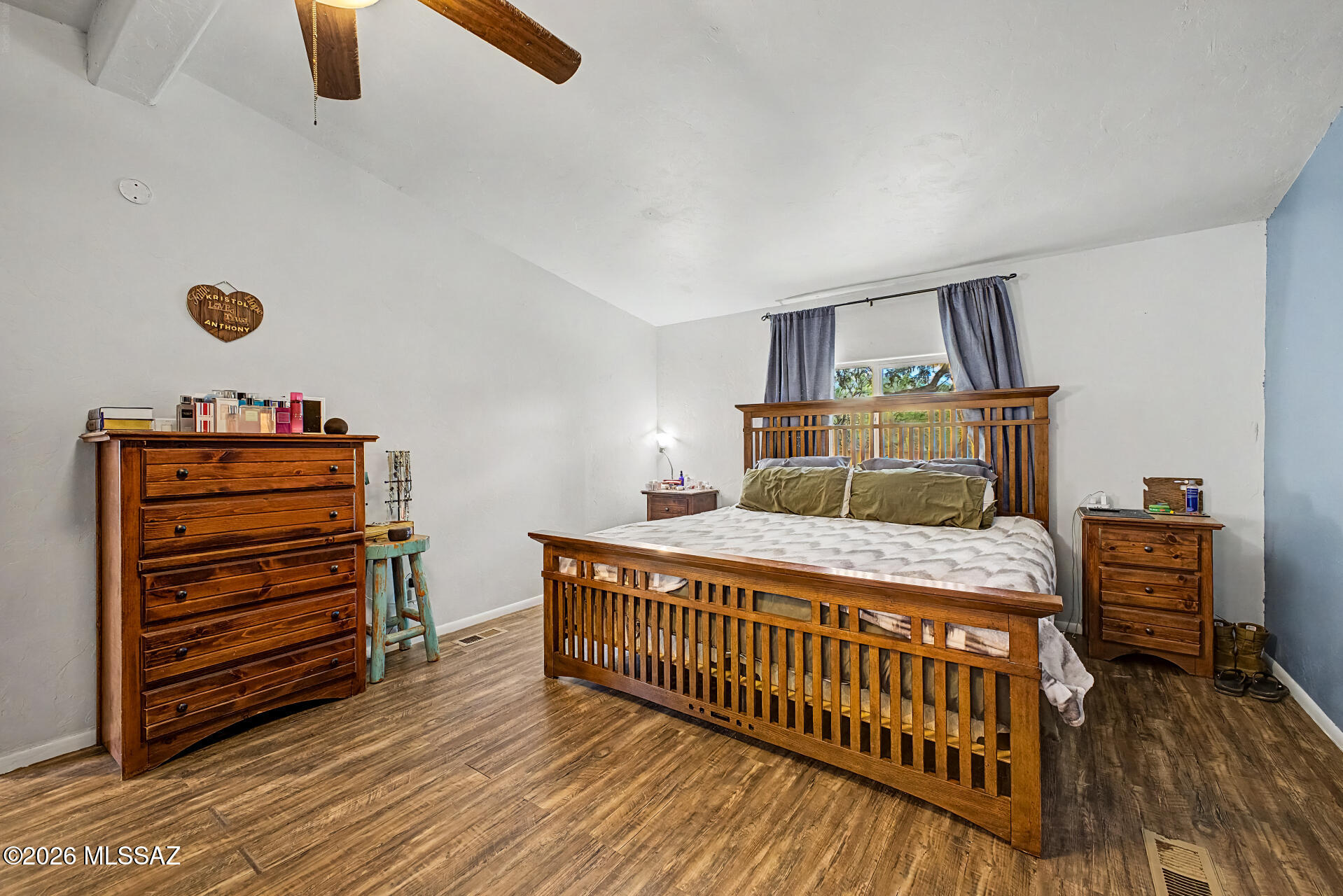 4231 East Pinal Street Tucson, AZ 85739 - Photo 24 of 36 a bedroom with a bed and wooden floor