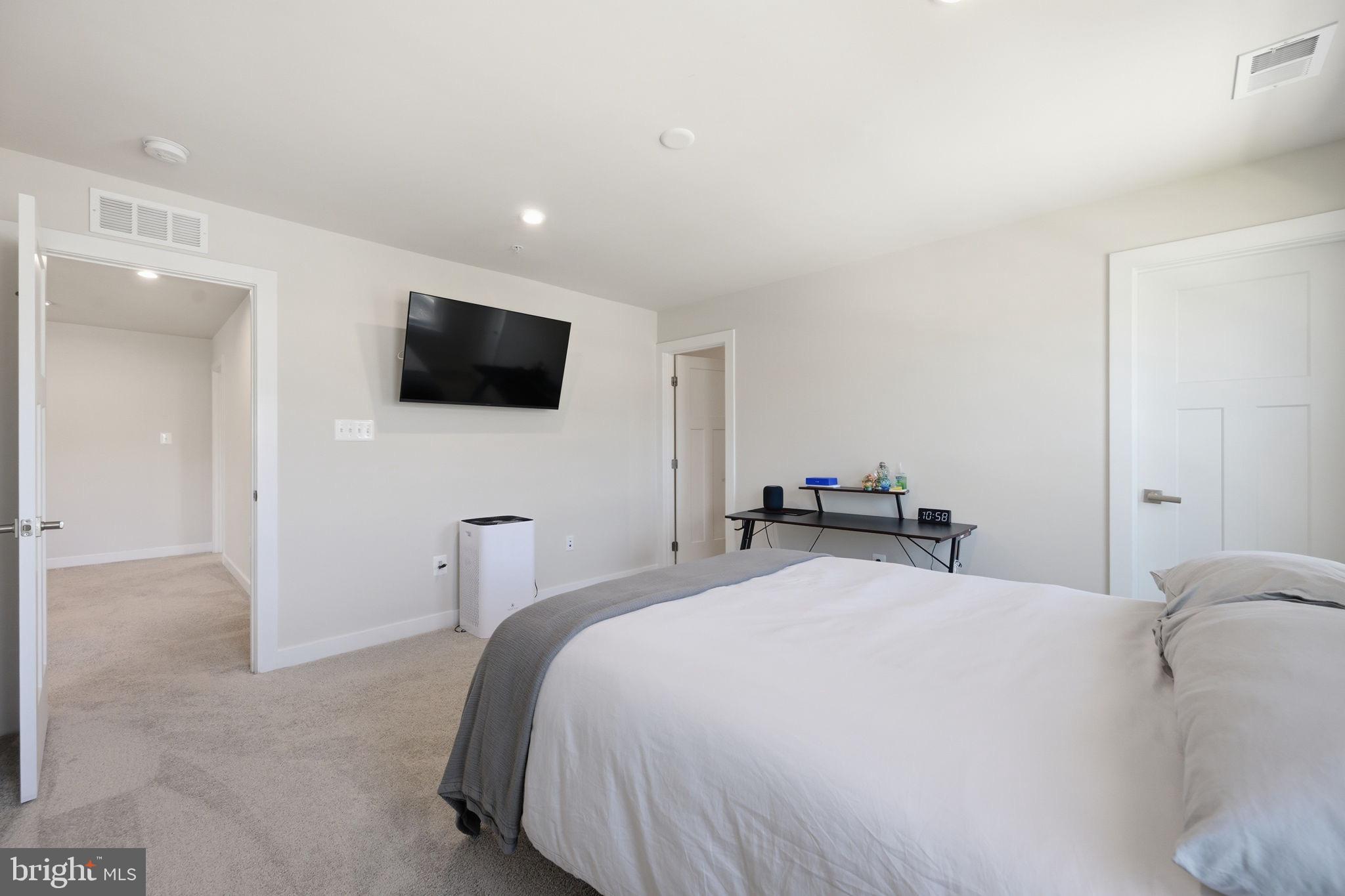 1321 Upper Patuxent Ridge Road Odenton, MD 21113 - Photo 42 of 48 Modern bedroom with serene ambiance.