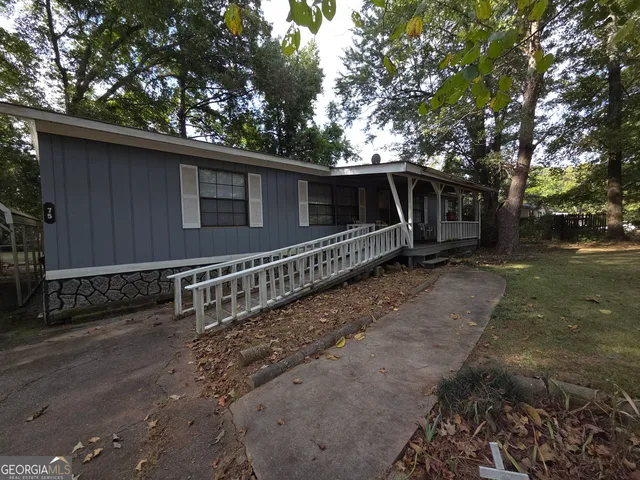 a side view of a house with a yard