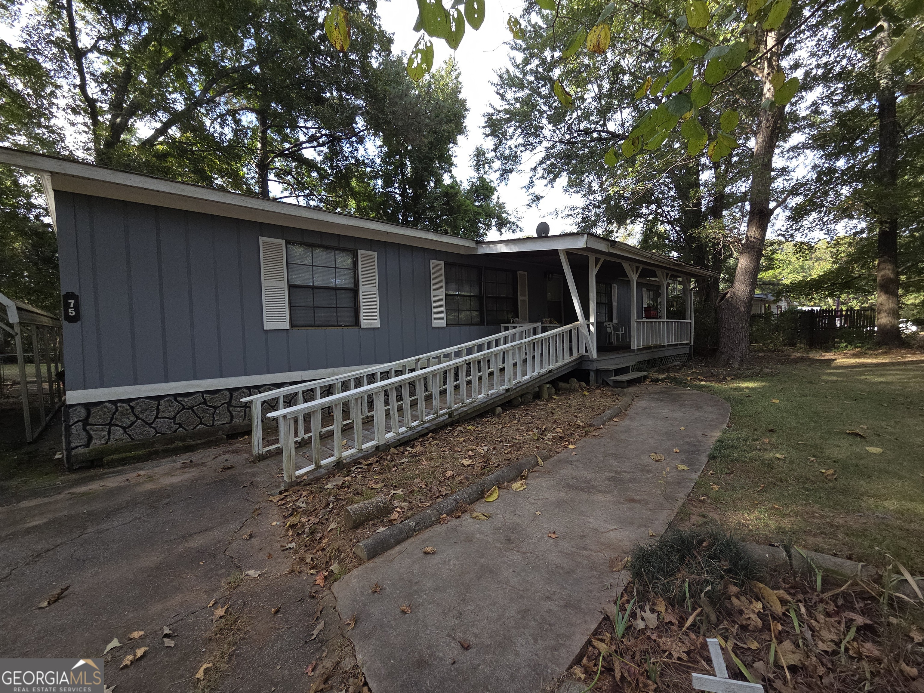 a side view of a house with a yard