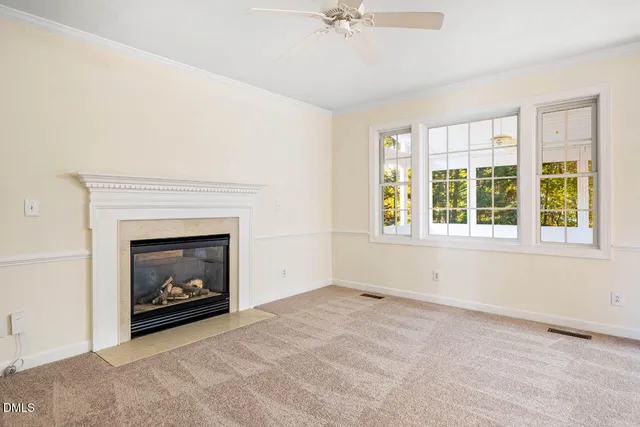 a living room with a fireplace and a window