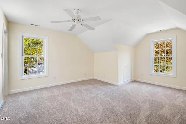 a bathroom with a double vanity sink toilet mirror and bathtub