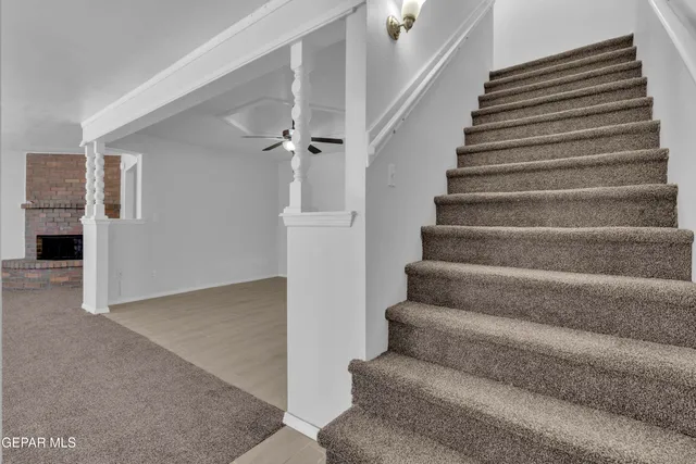 a room with a bed and a dresser