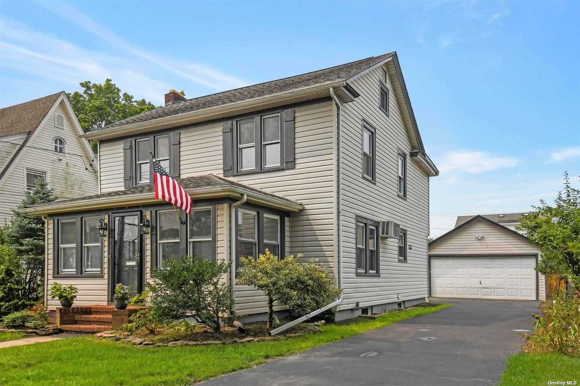 155 Emory Road Mineola, NY 11501 - Photo 1 of 1 front view of a house with a yard