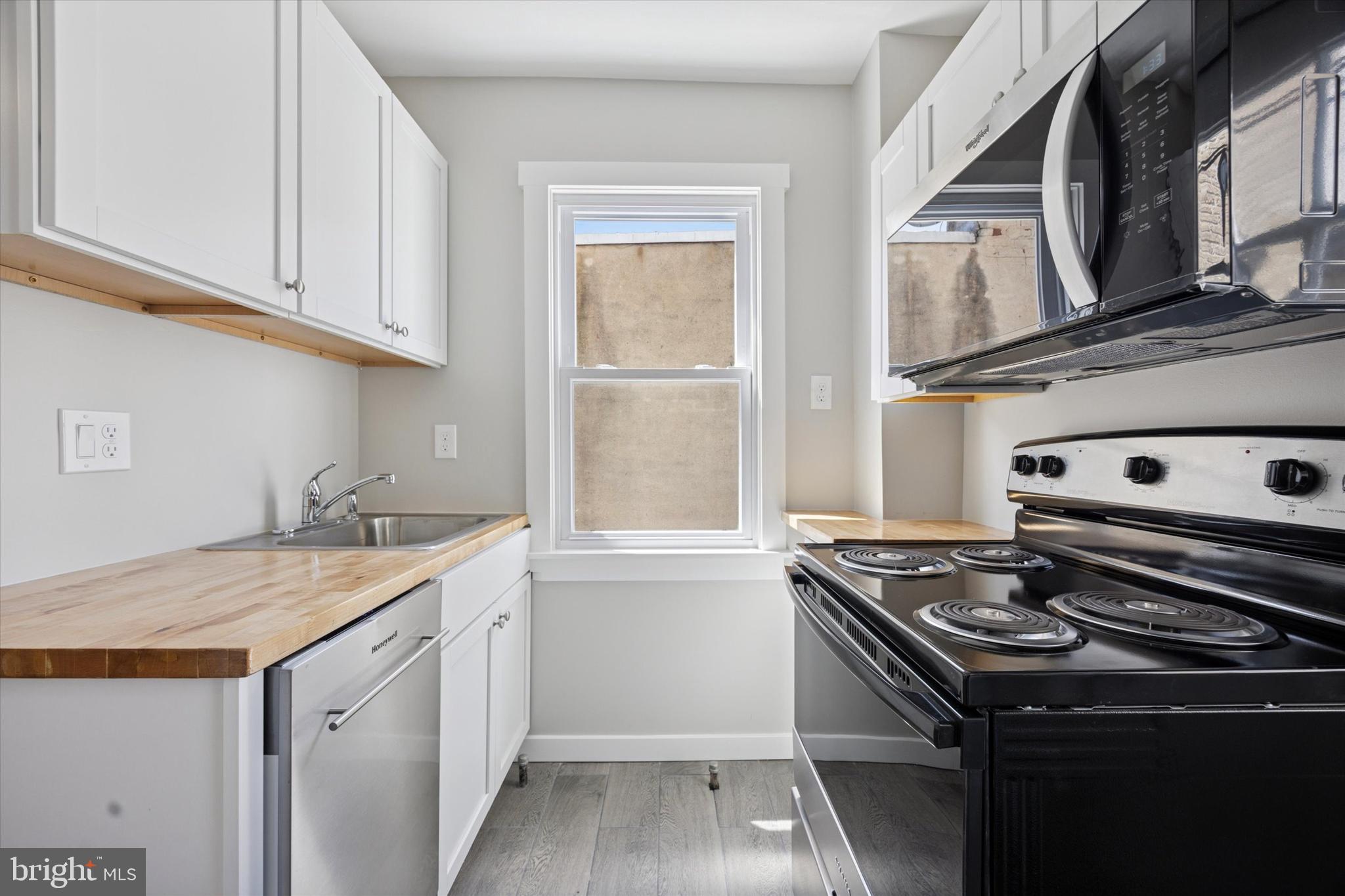 241 Haverford Avenue, Unit 3 Narberth, PA 19072 - Photo 13 of 13 a kitchen with a stove and a sink