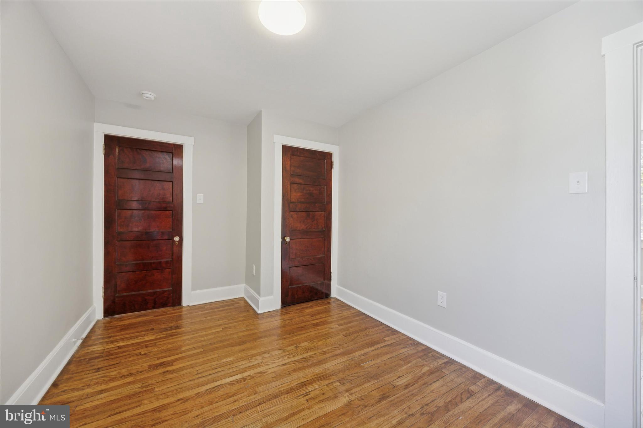 241 Haverford Avenue, Unit 3 Narberth, PA 19072 - Photo 5 of 13 an empty room with wooden floor and closet