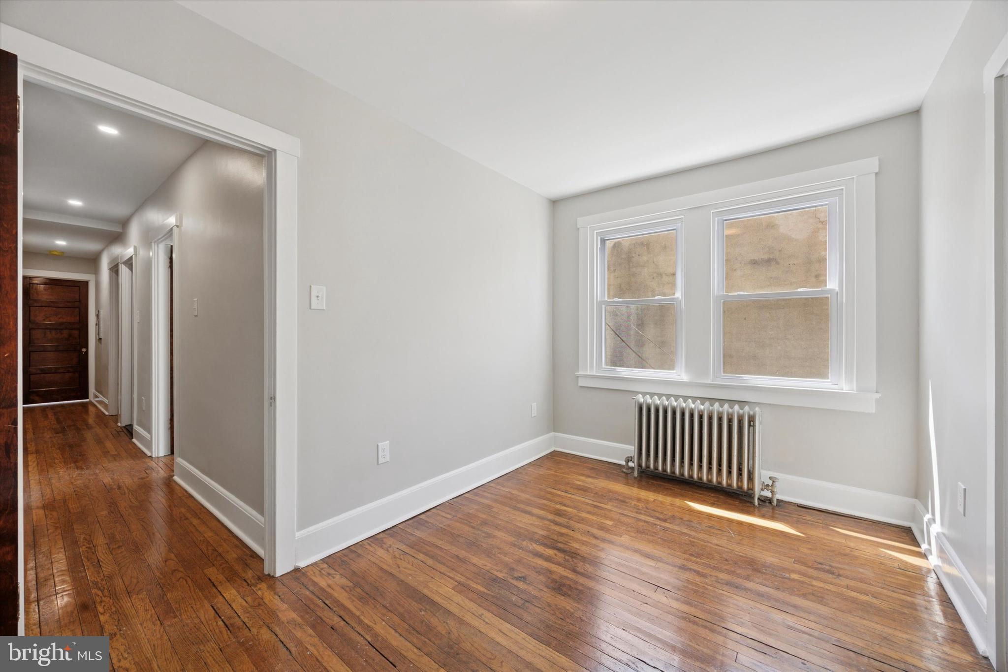 241 Haverford Avenue, Unit 3 Narberth, PA 19072 - Photo 9 of 13 a view of empty room with wooden floor and fan