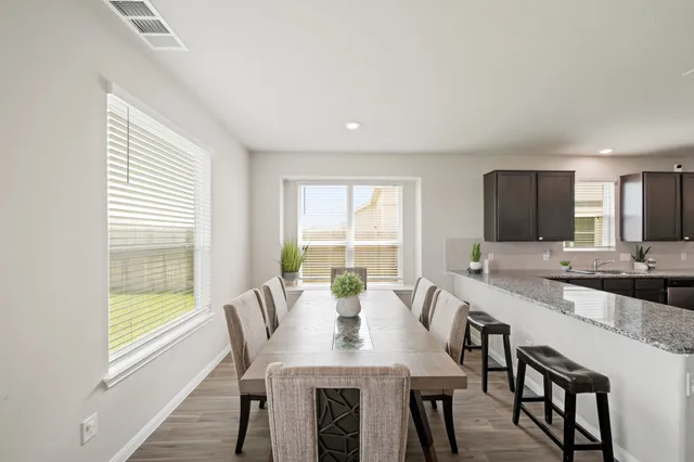 a living room with furniture potted plant and a window