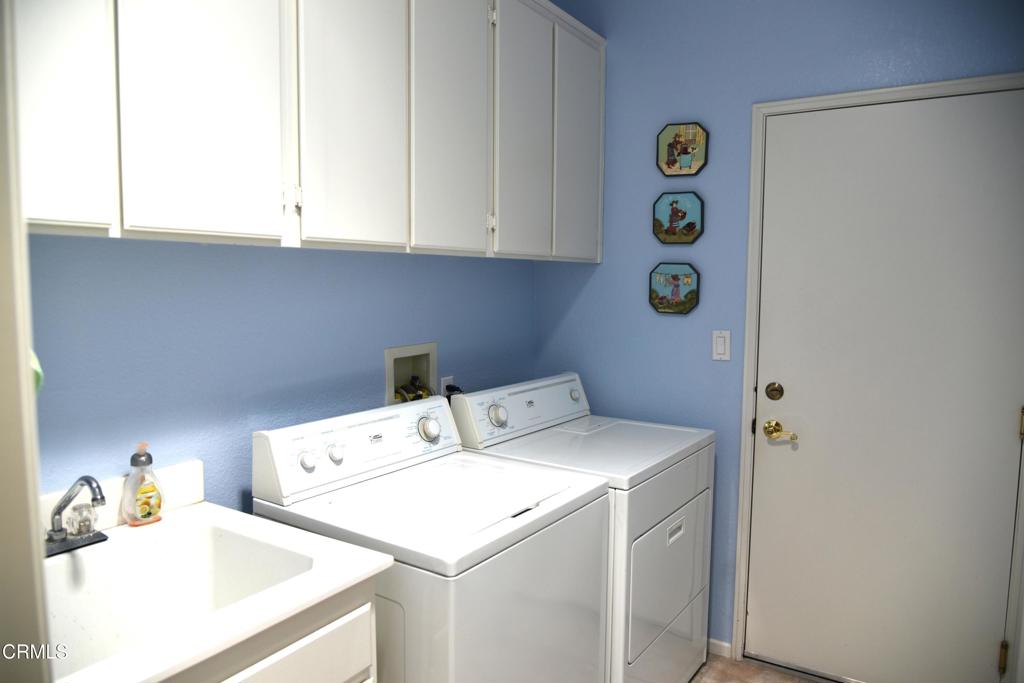 23805 Vía Compadres Murrieta, CA 92562 - Photo 8 of 13 a utility room with dryer and washer
