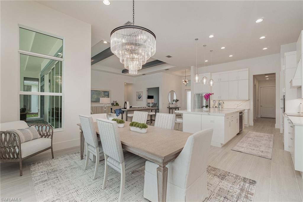 8900 Nevis Way Naples, FL 34112 - Photo 11 of 34 a view of a dining room with furniture