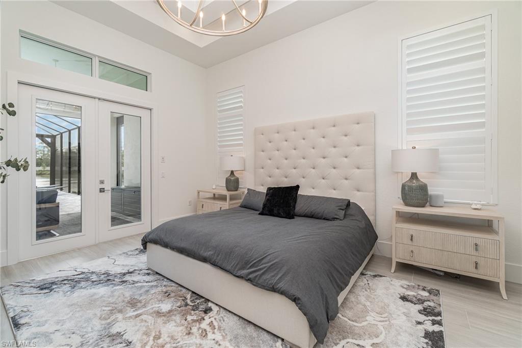 8900 Nevis Way Naples, FL 34112 - Photo 12 of 34 a bedroom with a bed and a window