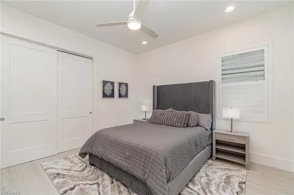 a bedroom with a bed and a tv