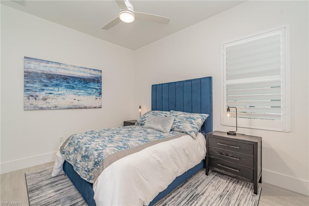 8900 Nevis Way Naples, FL 34112 - Photo 20 of 34 a bedroom with a bed and a window