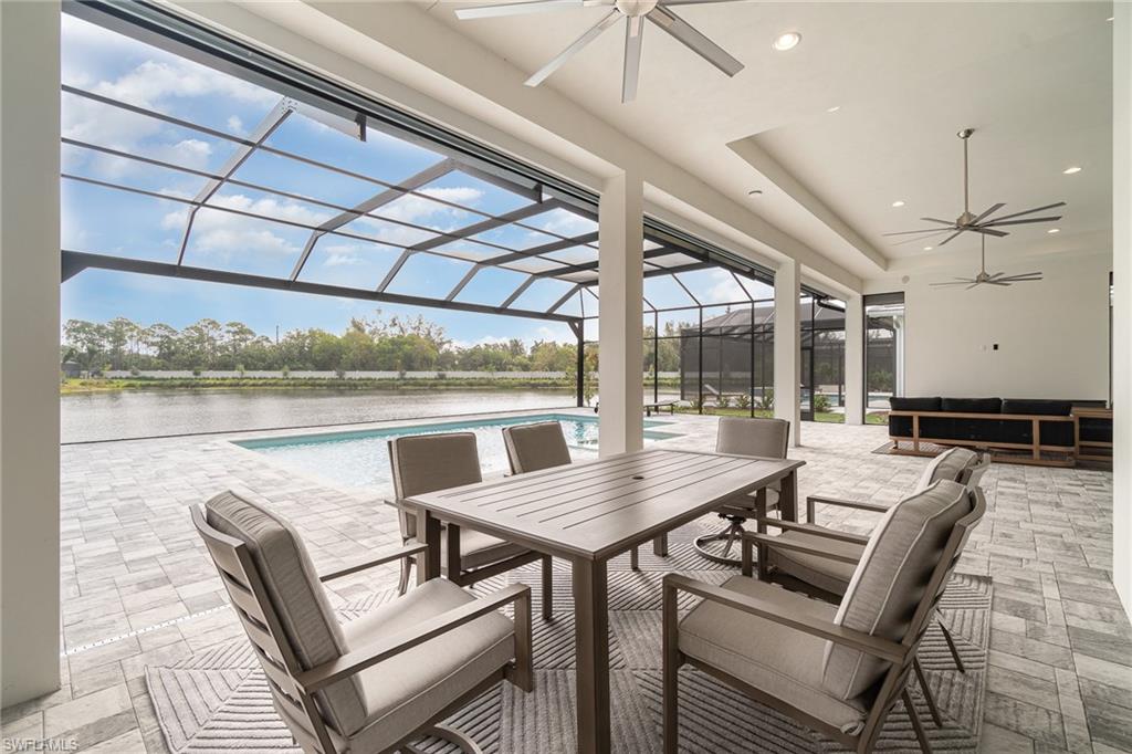 8900 Nevis Way Naples, FL 34112 - Photo 27 of 34 a view of a dining room with furniture window and outside view