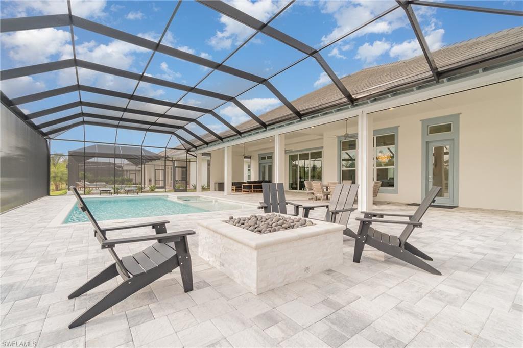 8900 Nevis Way Naples, FL 34112 - Photo 28 of 34 a building outdoor space with a couch