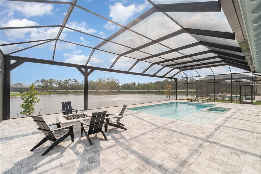 8900 Nevis Way Naples, FL 34112 - Photo 29 of 34 a view of a swimming pool with a patio