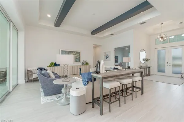 a dining room with furniture and wooden floor