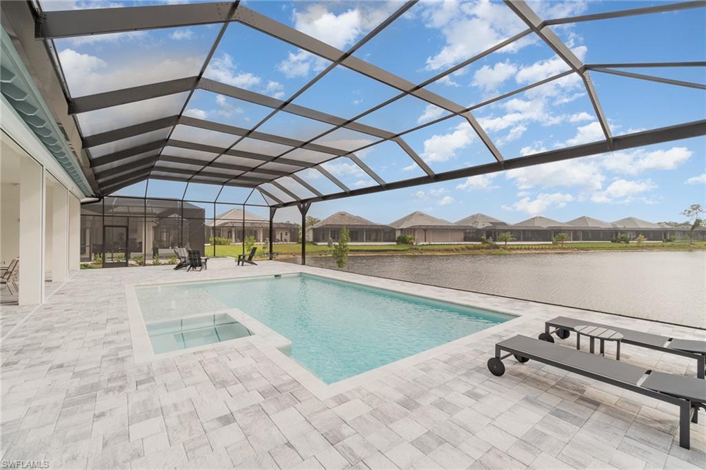 8900 Nevis Way Naples, FL 34112 - Photo 31 of 34 a view of a backyard of lake and mountain view