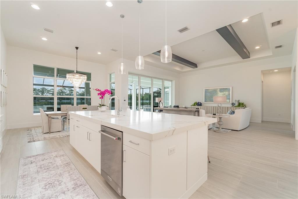 8900 Nevis Way Naples, FL 34112 - Photo 8 of 34 a large white kitchen with a large window