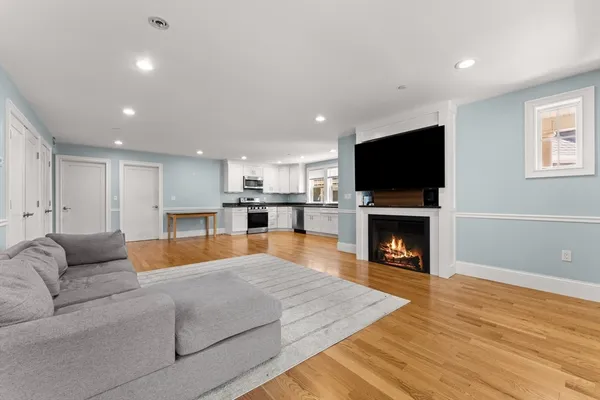 a living room with furniture and a fireplace or television