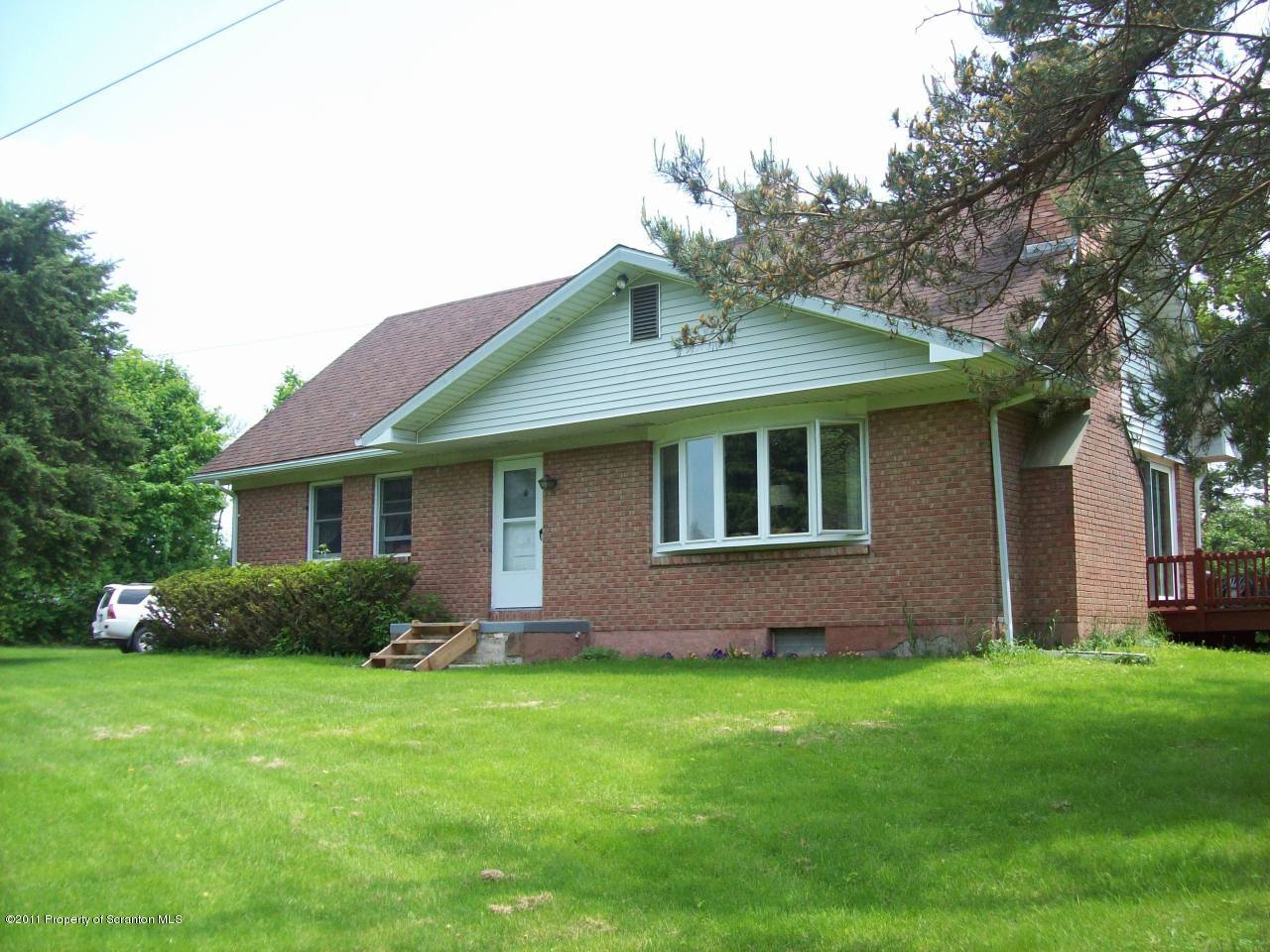 4302 State Rte 2014 Forest City, PA 18421 - Photo 8 of 14 a front view of a house with garden
