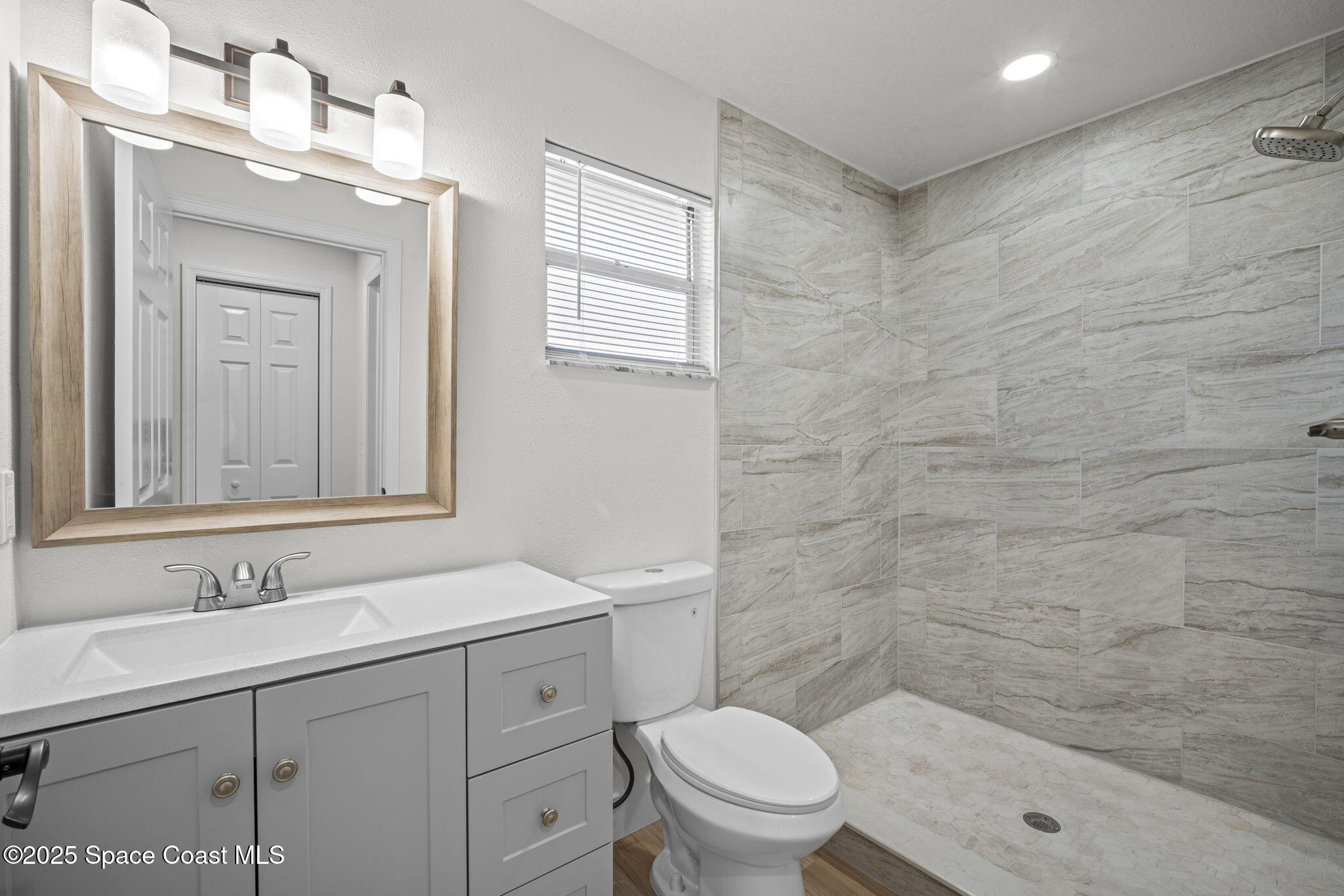 5130 Carter Street Cocoa, FL 32927 - Photo 18 of 33 a bathroom with a sink a toilet and shower