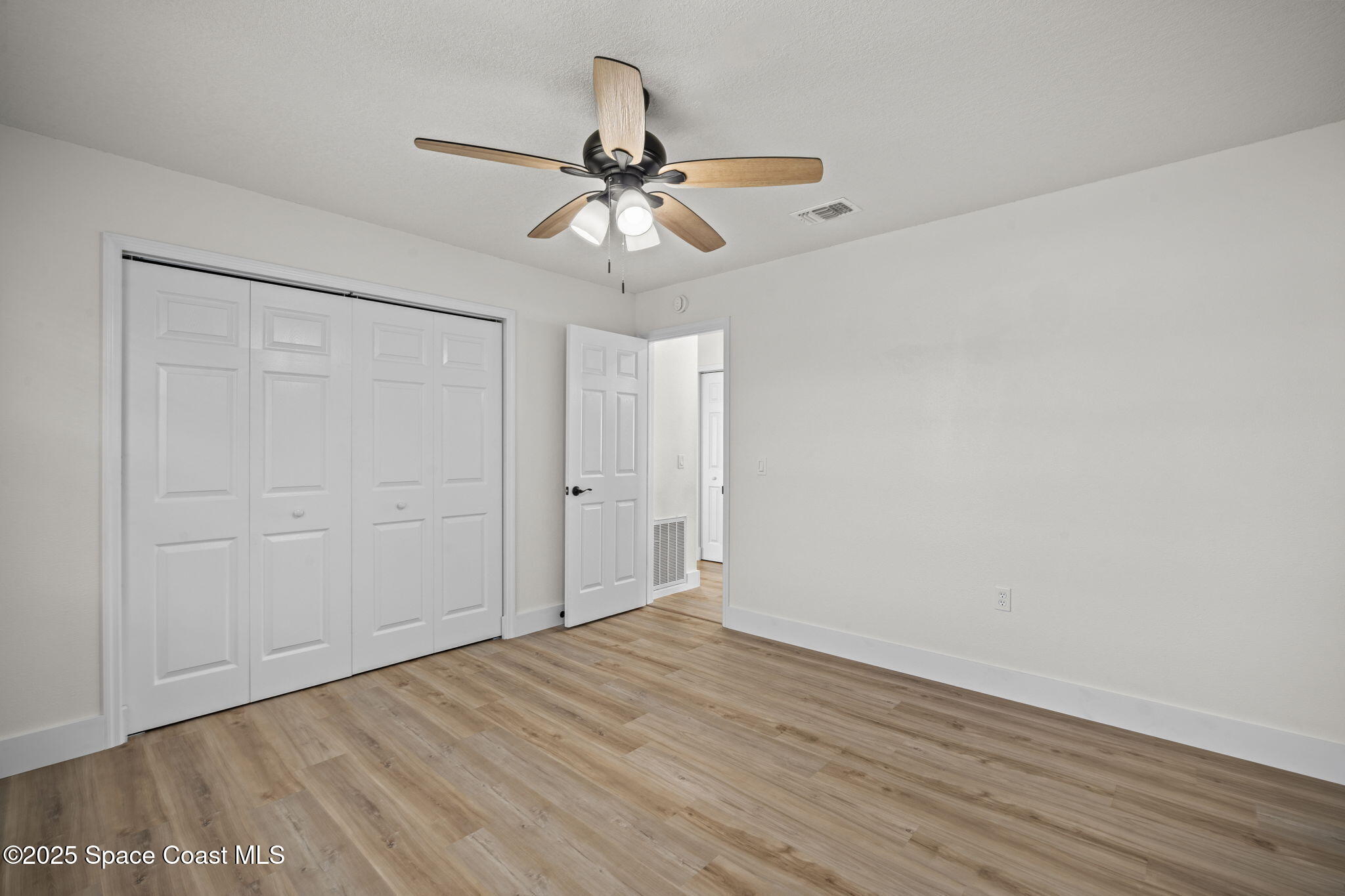 5130 Carter Street Cocoa, FL 32927 - Photo 25 of 33 wooden floor in an empty room