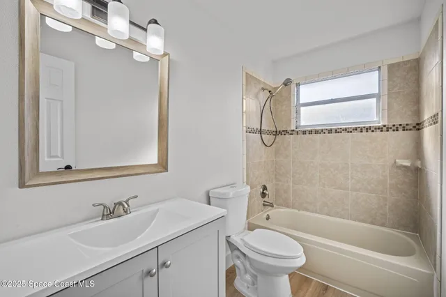 a bathroom with a sink a toilet and a bathtub