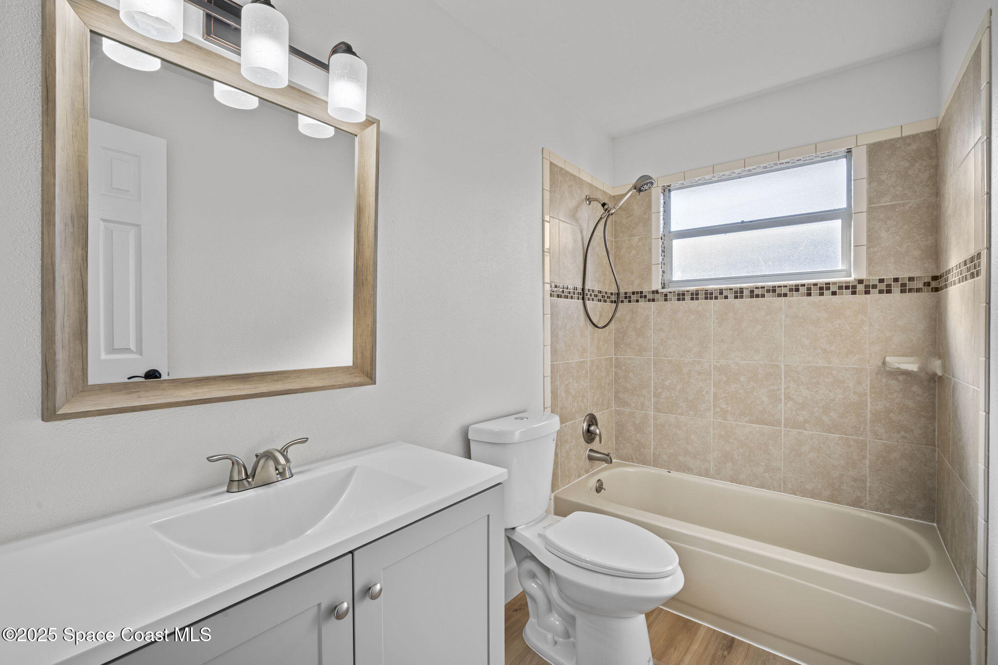 5130 Carter Street Cocoa, FL 32927 - Photo 26 of 33 a bathroom with a sink a toilet and a bathtub