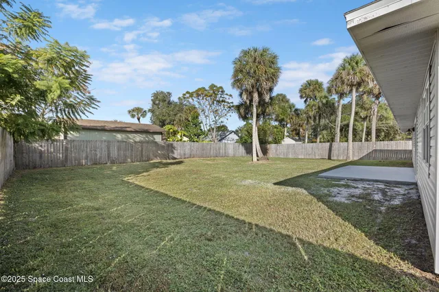 a view of a backyard with green space