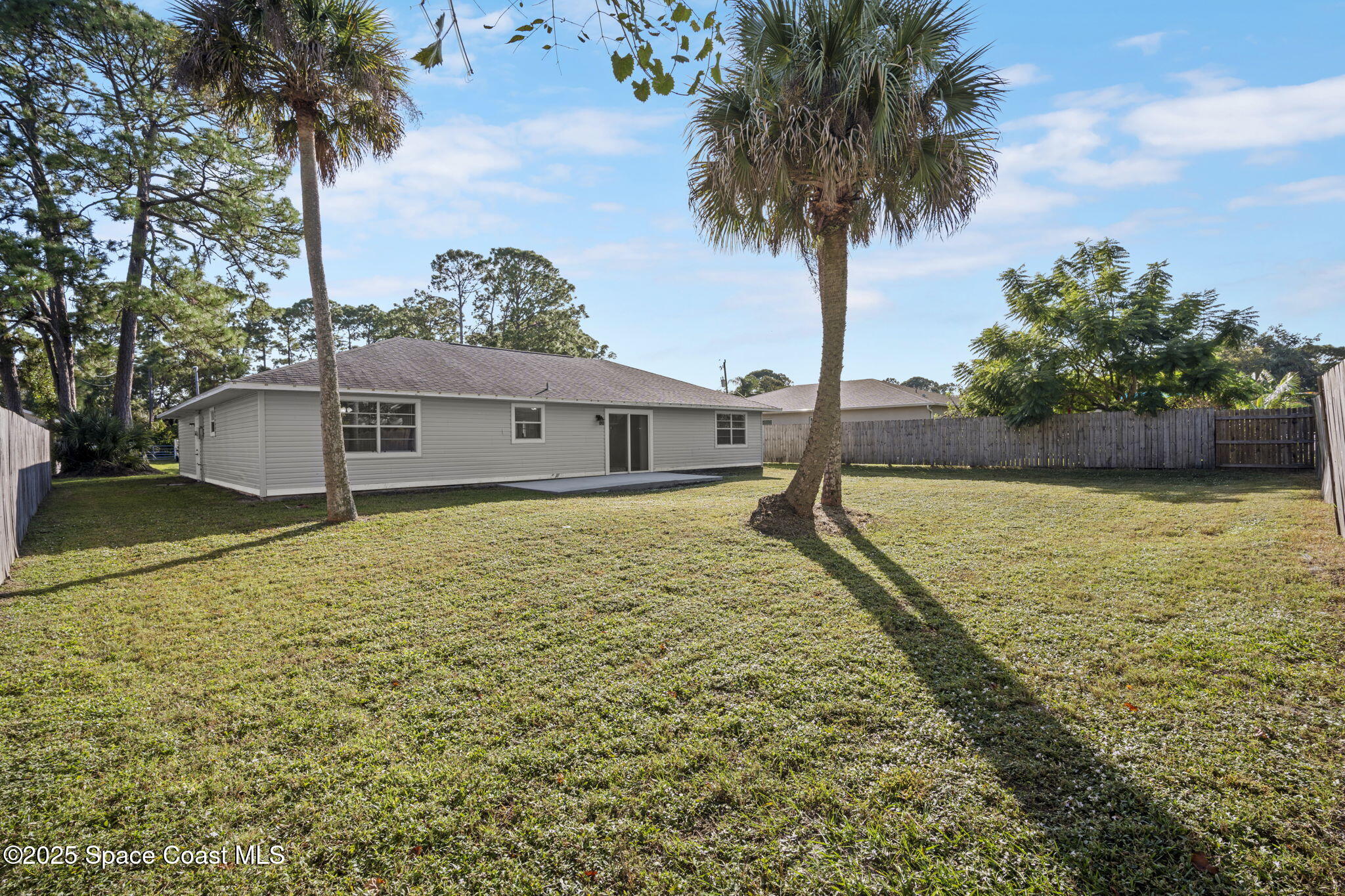 5130 Carter Street Cocoa, FL 32927 - Photo 29 of 33 a house view with swimming pool and trees