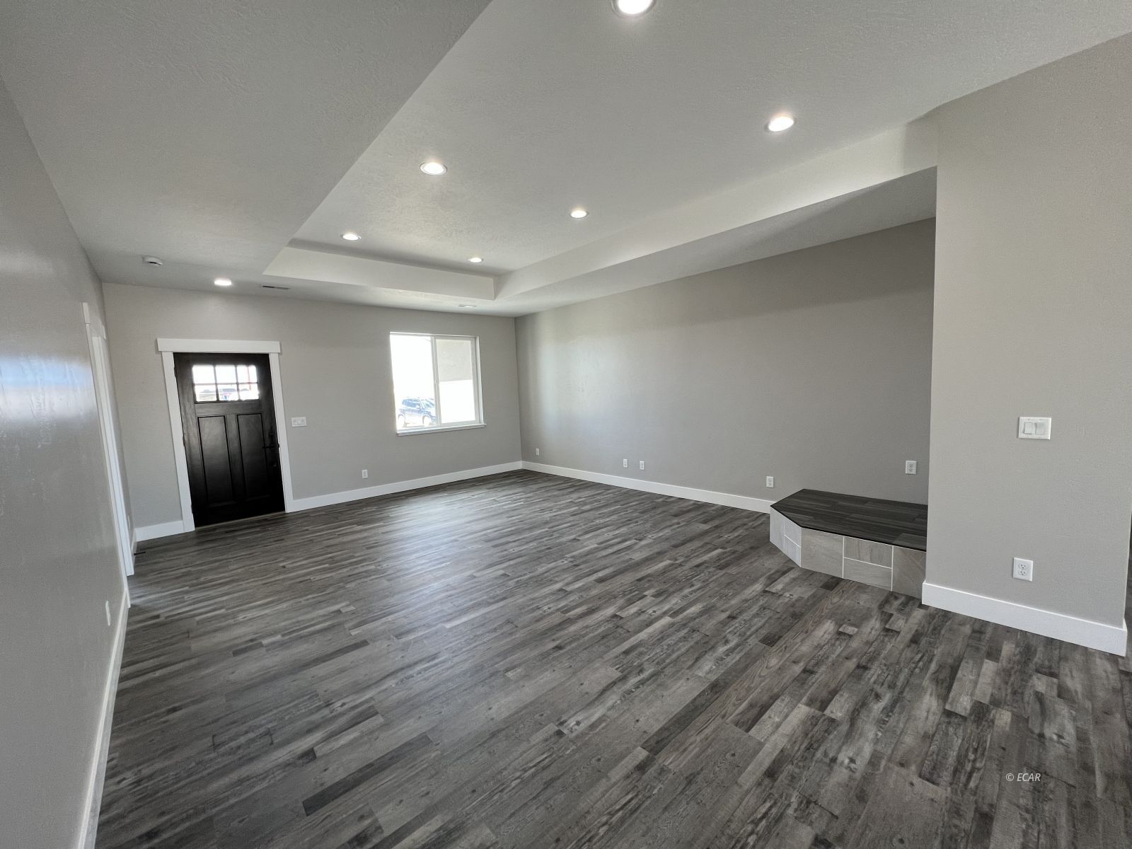 1265 Sun Vly Road Spring Creek, NV 89815 - Photo 3 of 34 an empty room with wooden floor and windows