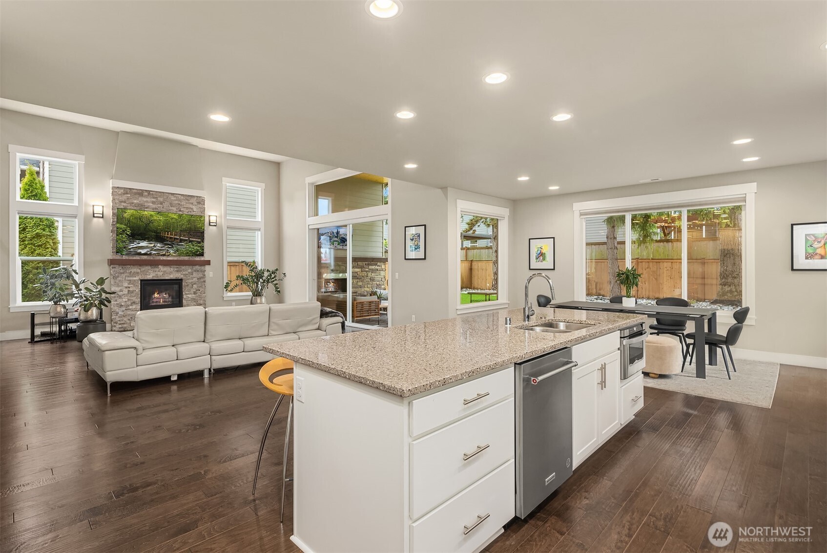 1435 242nd Place Southeast Bothell, WA 98021 - Photo 20 of 40 a large kitchen with stainless steel appliances lots of white furniture a window and wooden floor